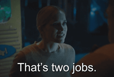 Woman Says That's Two Jobs Standing Next To Man GIF