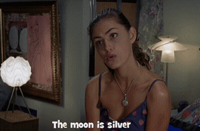 Woman Says The Moon Is Silver In Front Of Lamp GIF