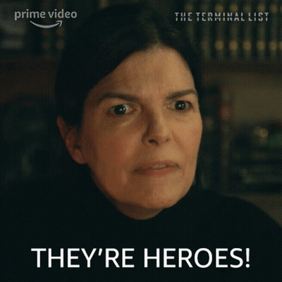 Woman Says They're Heroes In Front Of Prime Video Sign GIF