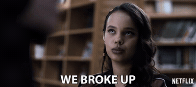 Woman Says We Broke Up In Front Of Netflix Sign GIF