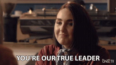 Woman Says You're Our True Leader Sitting at Table