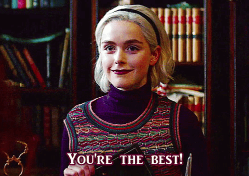 Woman Says You're The Best In Front Of Bookcase GIF