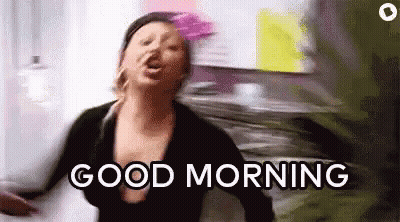 Woman Screaming Good Morning In Front Of Papers GIF