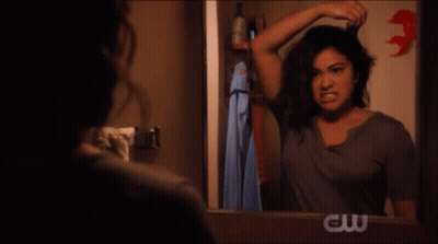 Woman Screaming In Front Of Mirror With CW Logo GIF