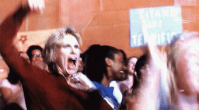 Woman Screaming In Front Of Titans Sign GIF
