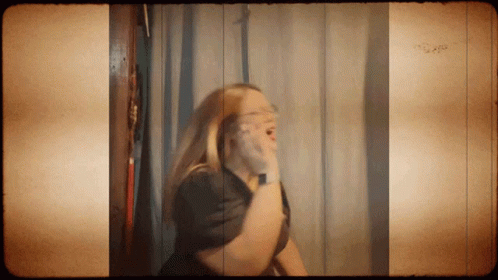 Woman Shaving Face In Mirror GIF