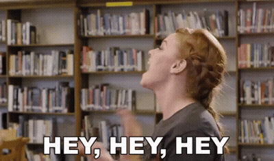 Woman Shouting Hey In Library GIF
