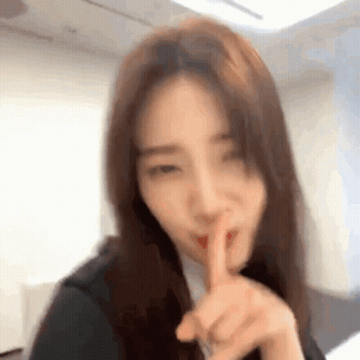 Woman Shushing With Finger To Lips GIF