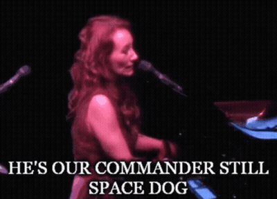 Woman Singing He's Our Commander Still Space Dog GIF