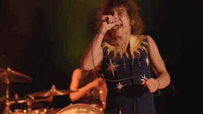 Woman Singing In Blue And Yellow Dress GIF