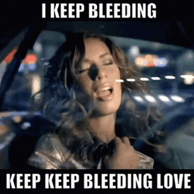 Woman Singing In Car I Keep Bleeding Love GIF