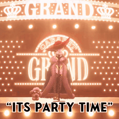 Woman Singing In Front Of Grand Sign GIF