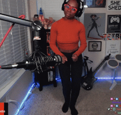 Woman Singing In Front Of She Shed Sign GIF