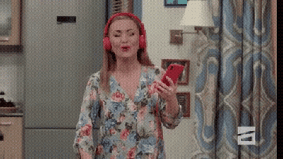 Woman Singing Into Cell Phone GIF