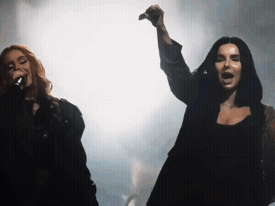 Woman Singing Into Microphone Arm In Air GIF