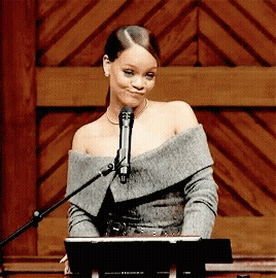 Woman Singing Into Microphone At Podium GIF