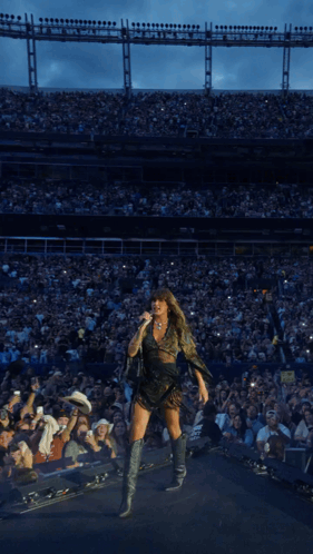 Woman Singing Into Microphone At Stadium GIF