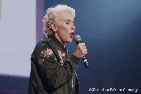 Woman Singing Into Microphone Christine Fekete Comedy GIF