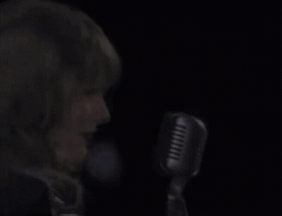 Woman Singing Into Microphone Eyes Closed GIF