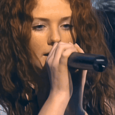 Woman Singing Into Microphone Eyes Closed GIF