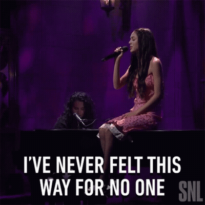 Woman Singing Into Microphone I've Never Felt This Way For No One GIF