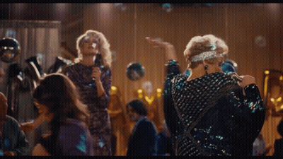 Woman Singing Into Microphone In Front Of Crowd GIF