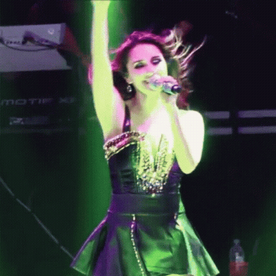 Woman Singing Into Microphone In Front Of Keyboard GIF