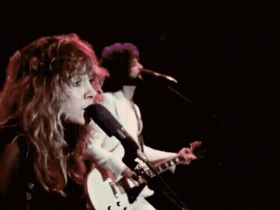 Woman Singing Into Microphone Next To Man GIF
