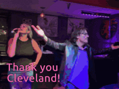 Woman Singing Into Microphone Next To Man Saying Thank You Cleveland GIF
