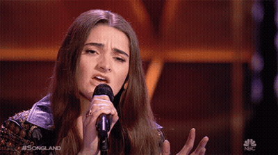 Woman Singing Into Microphone On NBC GIF