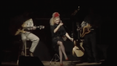 Woman Singing Into Microphone On Stage GIF