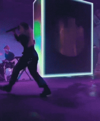 Woman Singing Into Microphone On Stage GIF
