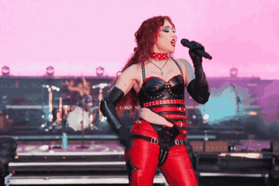 Woman Singing Into Microphone On Stage GIF