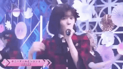 Woman Singing Into Microphone On Stage GIF