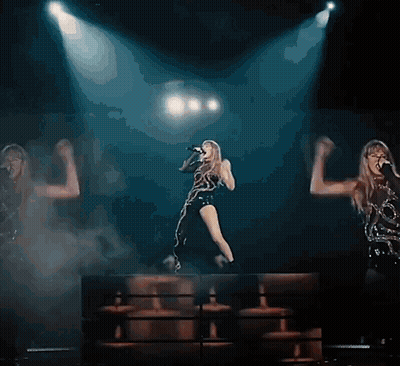 Woman Singing Into Microphone On Stage GIF