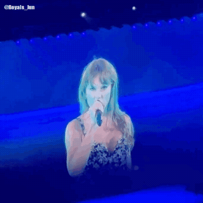 Woman Singing Into Microphone On Stage GIF