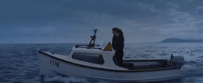 Woman Singing Into Microphone On Stage GIF