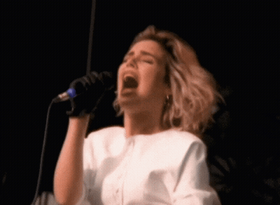 Woman Singing Into Microphone GIF
