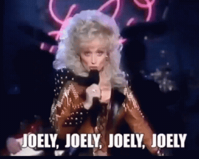Woman Singing Into Microphone Saying Joely Joely Joely GIF