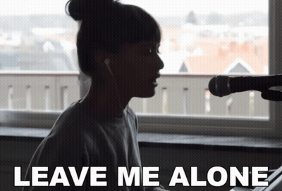 Woman Singing Into Microphone Saying Leave Me Alone GIF