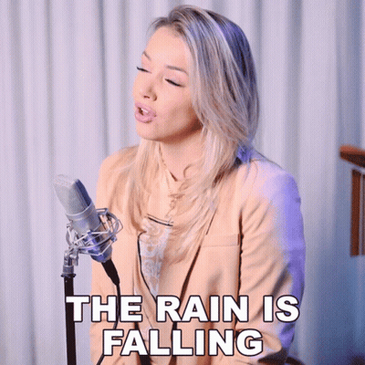 Woman Singing Into Microphone The Rain Is Falling GIF