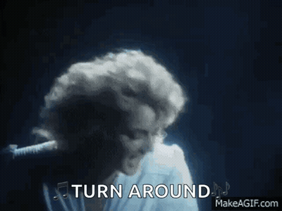 Woman Singing Into Microphone Turn Around GIF