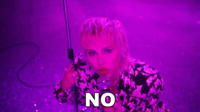 Woman Singing Into Microphone Under Purple Light GIF