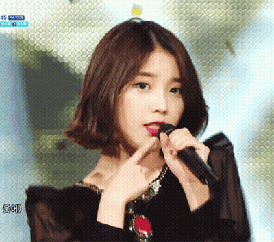 Woman Singing Into Microphone With 45 GIF