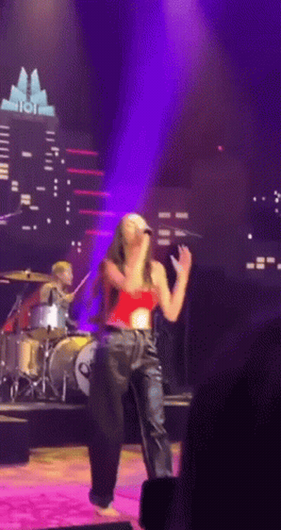 Woman Singing Into Microphone With Drummer GIF