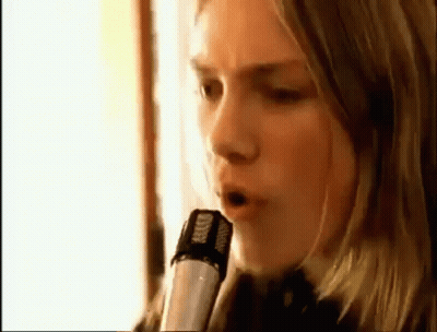 Woman Singing Into Microphone With Headphones GIF