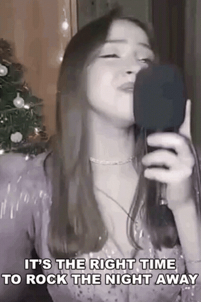 Woman Singing Into Microphone With Lyrics GIF