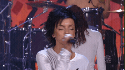 Woman Singing Into Microphone With NBC Logo GIF