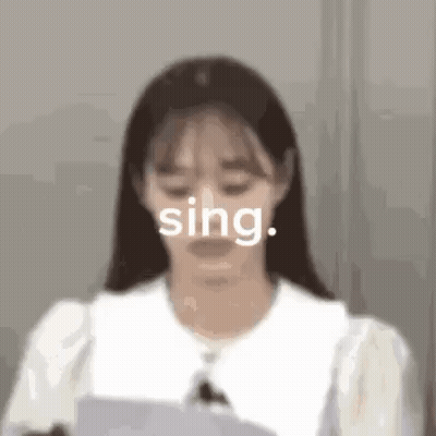 Woman Singing Into Microphone With Paper GIF