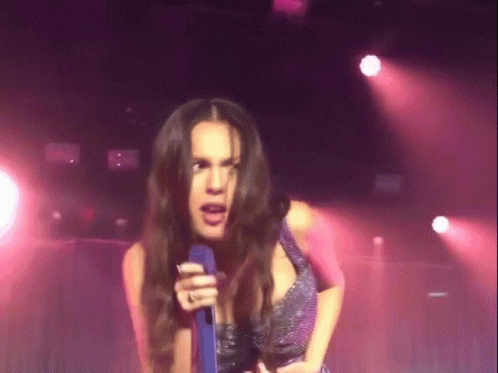 Woman Singing Into Microphone With Ring GIF